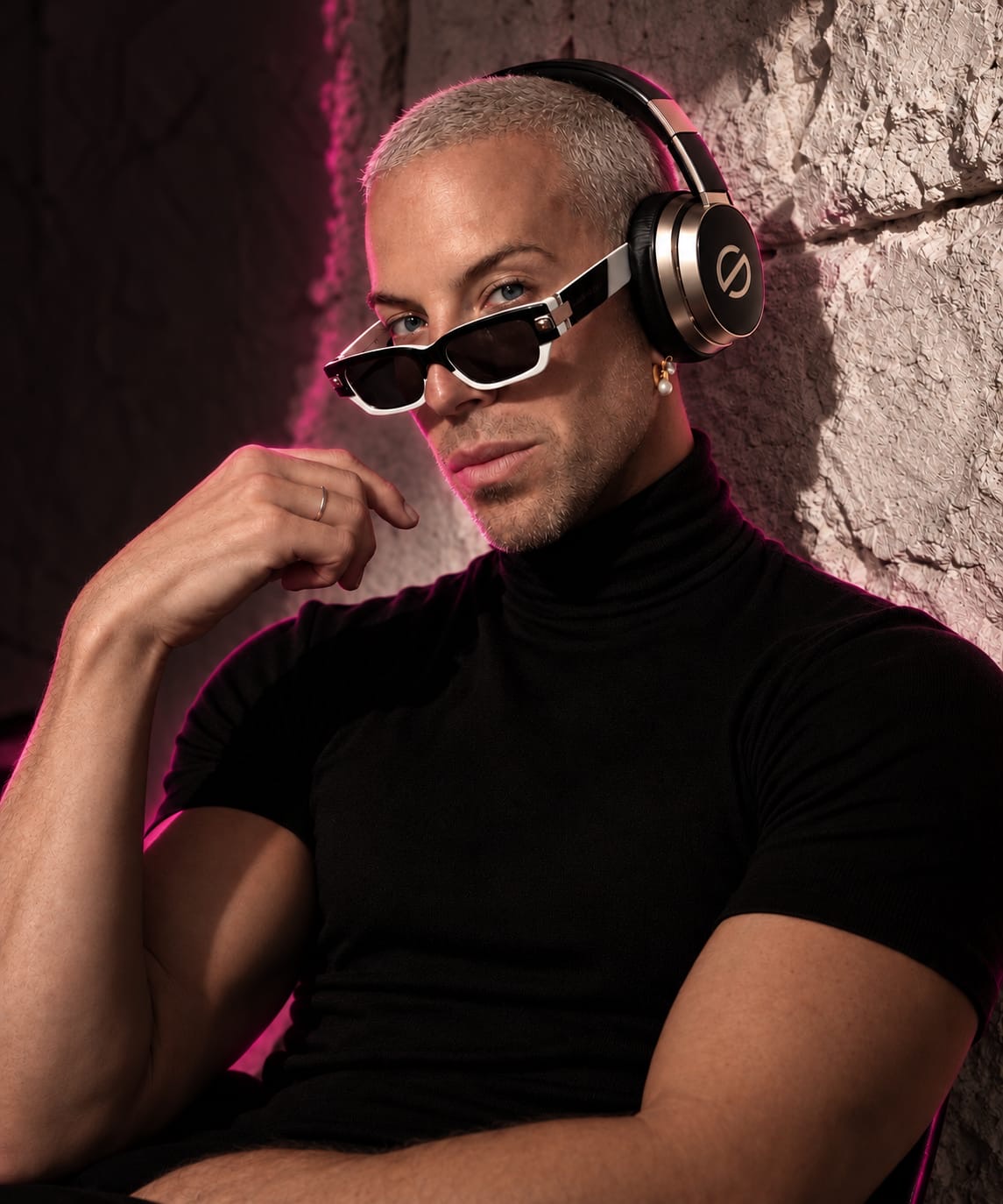 Christopher Macken, wearing SUG headphones and sunglasses